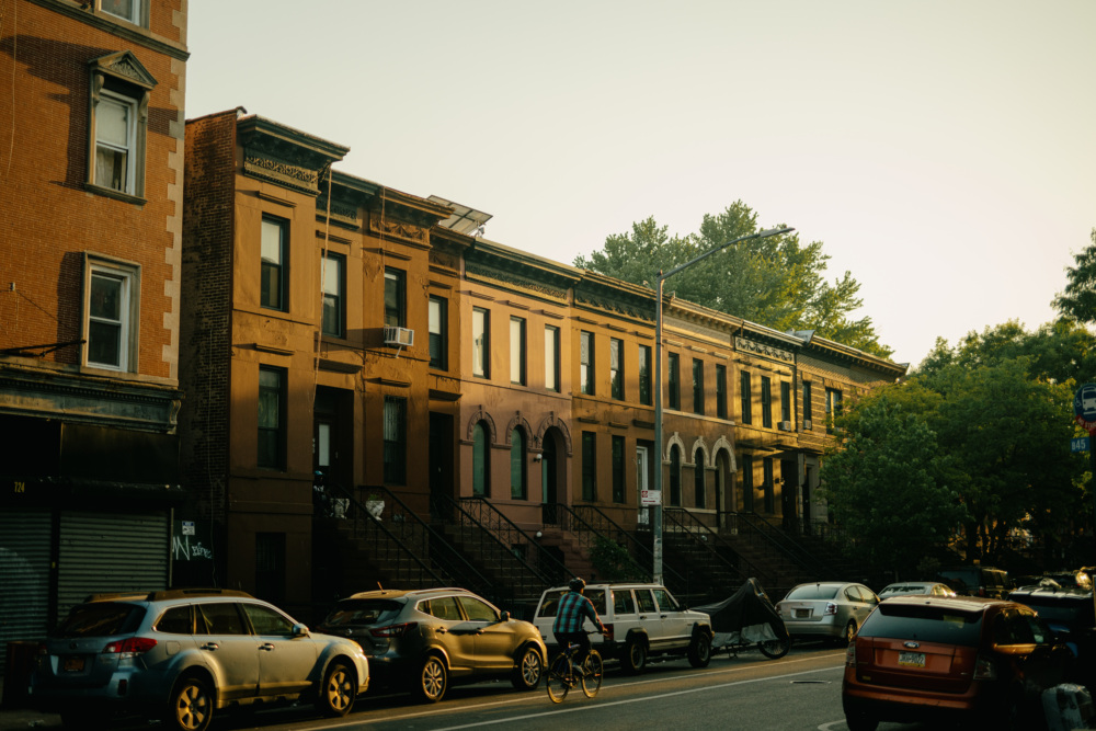 A row of brownstones in Crown Heights, Brooklyn at sunset