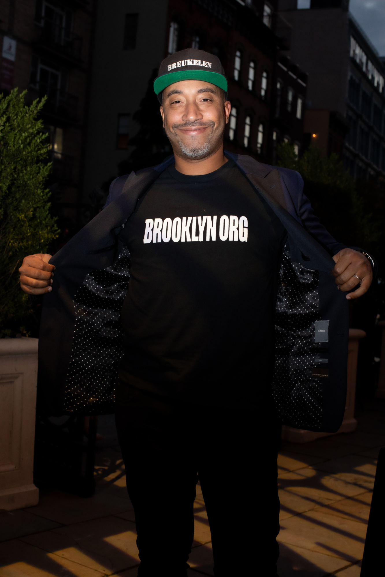 A man wearing a t - shirt that says brooklyn org.