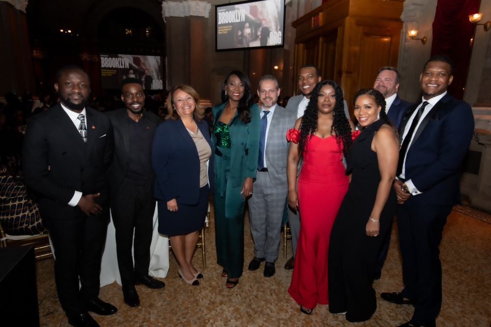 A group of people posing for a photo at an event.