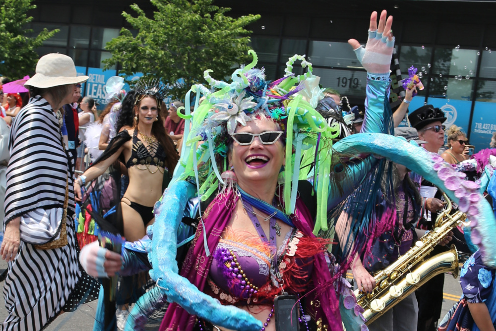 A woman in a costume poses at the Coney Island Mermaid Parade.
