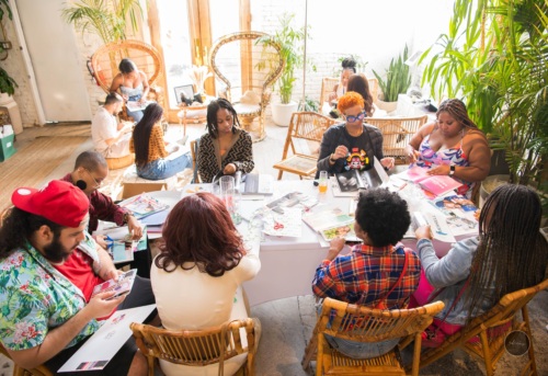 A group of people sitting around a table.