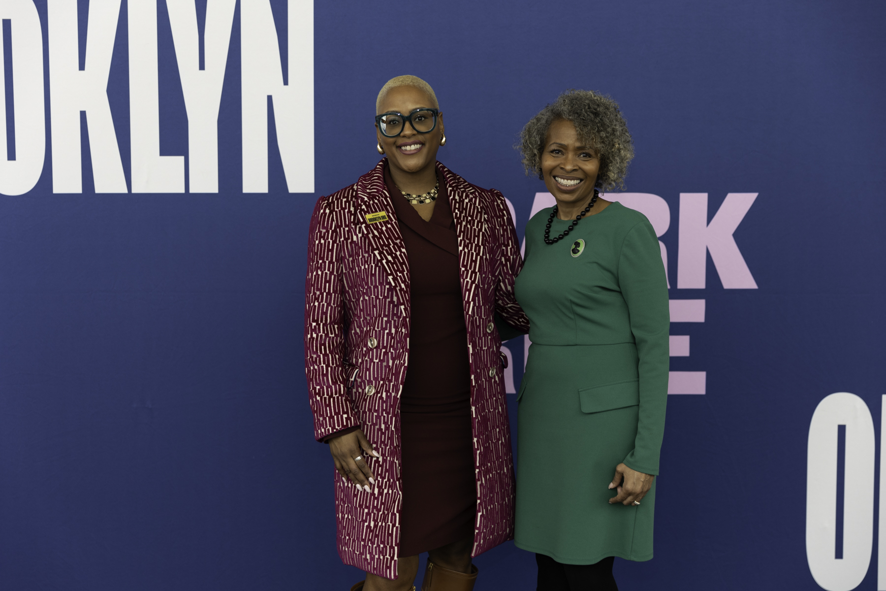 Two women smiling for a photo at a brooklyn book festival event.