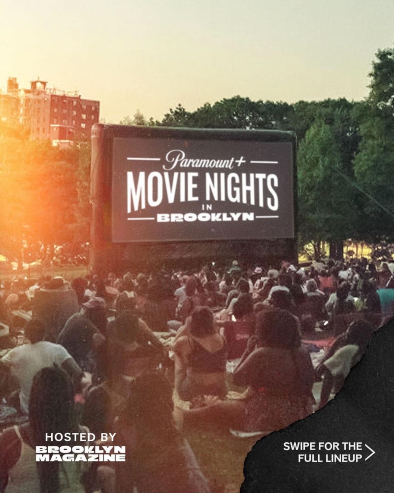 Outdoor movie screening event with a large crowd sitting on the grass in front of a Paramount+ Movie Nights in Brooklyn screen. Text reads, "Hosted by Brooklyn Magazine" and "Swipe for the full lineup.