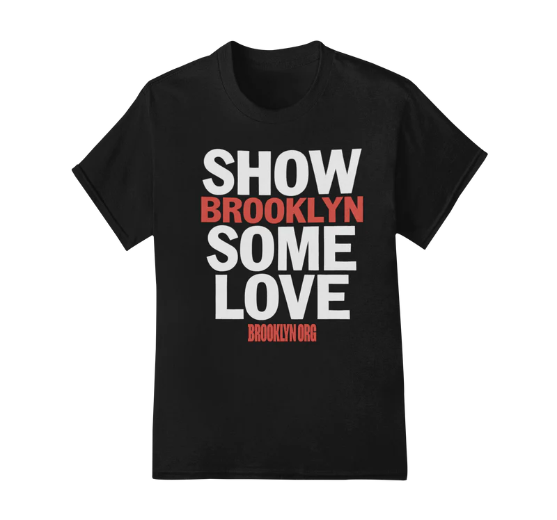Black T-shirt with bold white text reading "SHOW SOME LOVE" and red text "BROOKLYN" in the middle. Website "BROOKLYN.ORG" is printed at the bottom in red.