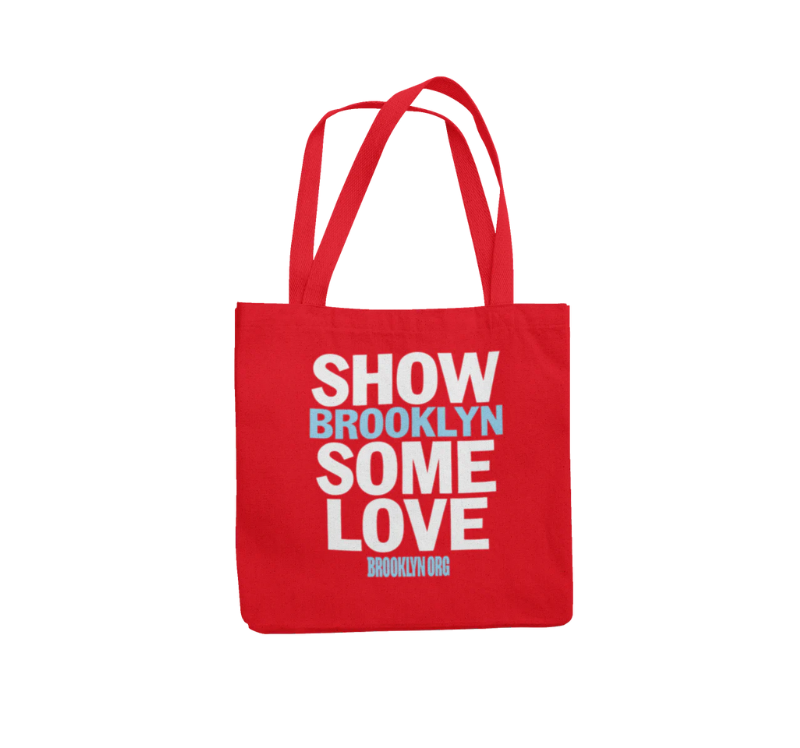 Red tote bag with "SHOW BROOKLYN SOME LOVE" and "BROOKLYN.ORG" printed in white and light blue block letters.