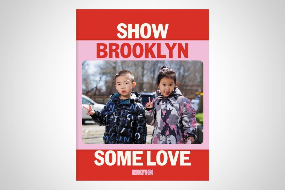 Two children in patterned jackets pose outdoors with peace signs, framed by text "Show Brooklyn Some Love" and a website URL.