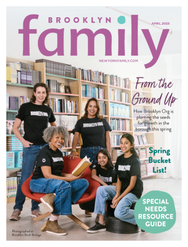 A group of five people, wearing "Brooklyn Org" shirts, pose in a cozy library setting for the April 2025 cover of Brooklyn Family magazine.