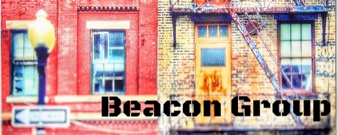 A brick building with two windows, a fire escape, a streetlamp, and a sign reading "Beacon Group" in bold black letters.