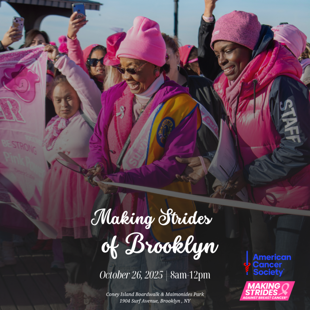A group of people in pink clothing participate in the Making Strides of Brooklyn breast cancer walk on the Coney Island Boardwalk.