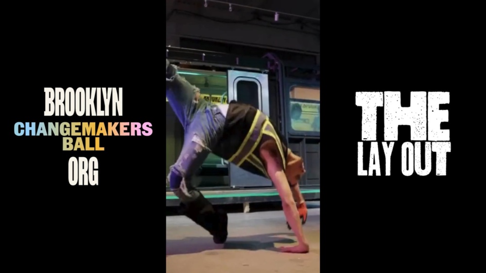 A person breakdances on a subway platform in front of an open train door. Text on the sides reads "Brooklyn Changemakers Ball org" and "The Lay Out.