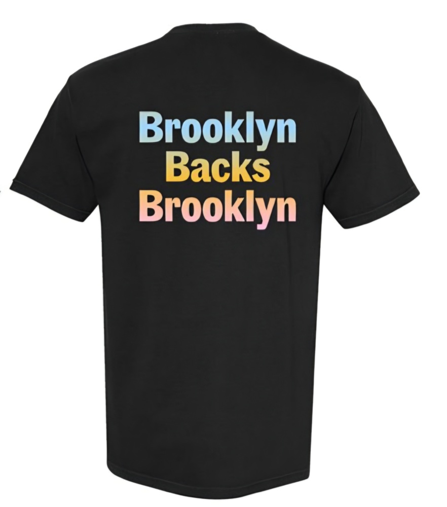 Black T-shirt with the phrase "Brooklyn Backs Brooklyn" printed on the back in blue, yellow, and pink block letters.