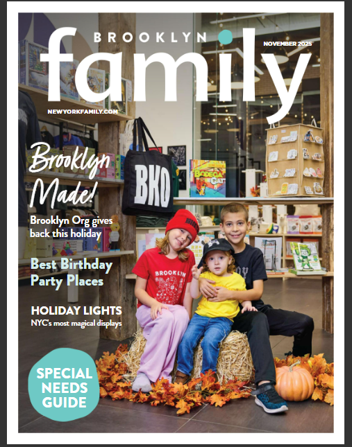 Three children sit together on a wooden floor with pumpkins, inside a store. Shelves with books and bags are in the background. The magazine cover reads "Brooklyn Family.