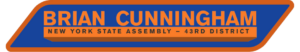 A blue and orange sign reads "Brian Cunningham, New York State Assembly – 43rd District.