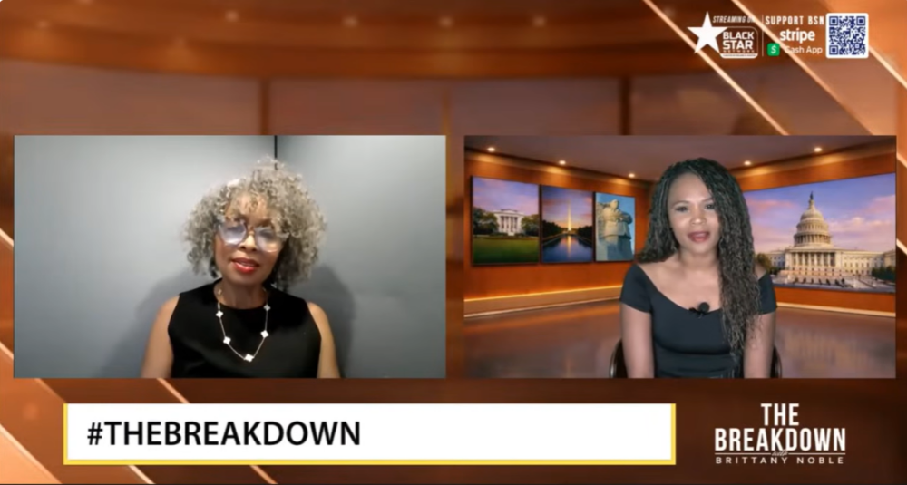 Two women speak during a virtual talk show called "The Breakdown with Brittany Noble." One is in a studio setting, the other in front of a plain gray wall. Hashtags and logos are displayed.