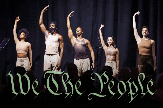 Five performers stand on stage with one arm raised, facing an audience, with the text “We The People” in ornate green lettering across the bottom.