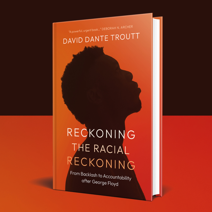 A book titled “Reckoning the Racial Reckoning” by David Dante Troutt features a silhouette of a man’s profile against an orange background.